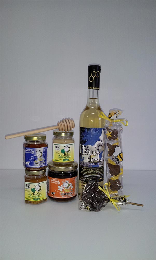 Miel crémeux, miel de trèfle, miel de bleuets, miel de sarrasin, suçon abeille, bâtonnet de bois, paquet de chocolats et hydromel Fleur-de-Lysé