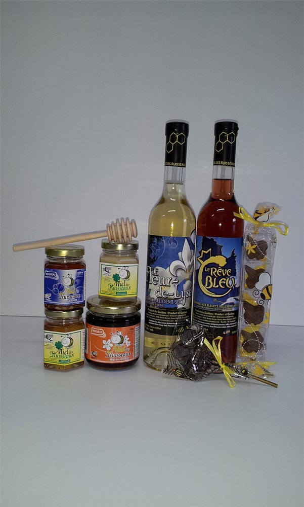 Miel crémeux, miel de trèfle, miel de bleuets, miel de sarrasin, suçon abeille, bâtonnet de bois, paquet de chocolats, hydromel Fleur-de-Lysé et hydromel Rêve bleu